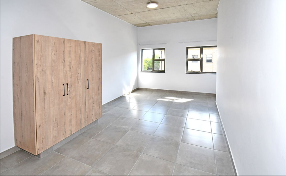 Large light oak built-in wardrobe spanning full bedroom wall, Durban