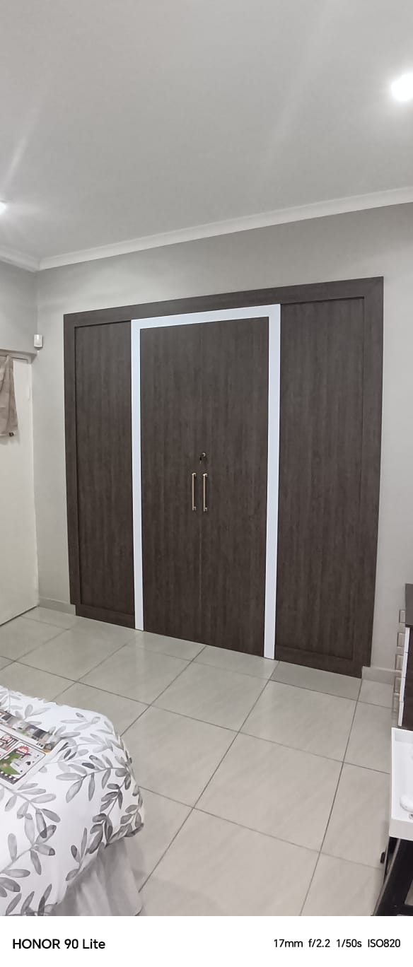 Full bedroom view - walk-in closet and desk area