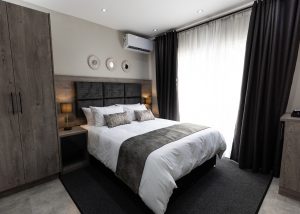 Luxury guesthouse en-suite bedroom cupboards — Ballito KZN by El-Shaddai Interiors