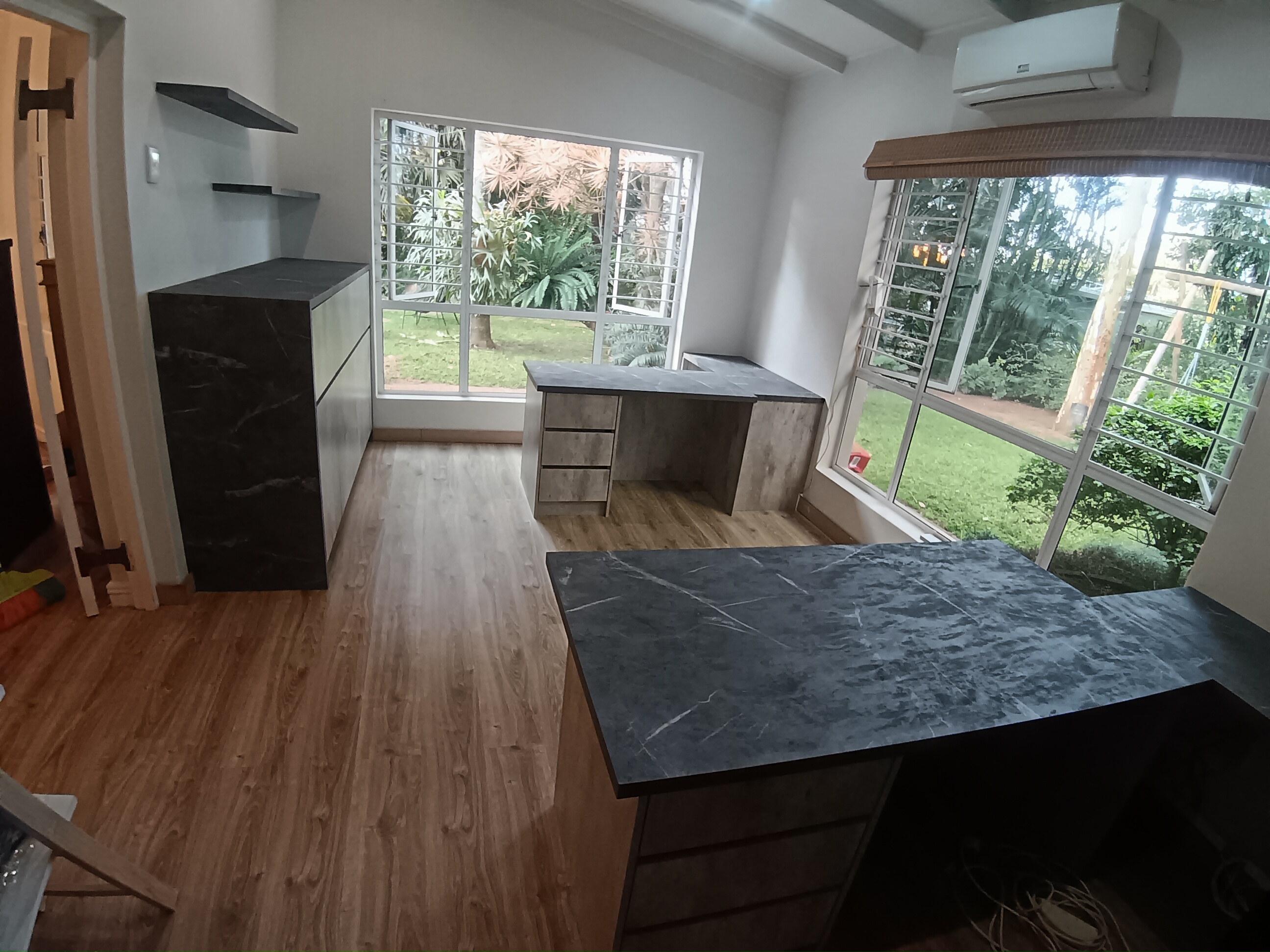 Full room view of integrated home office station