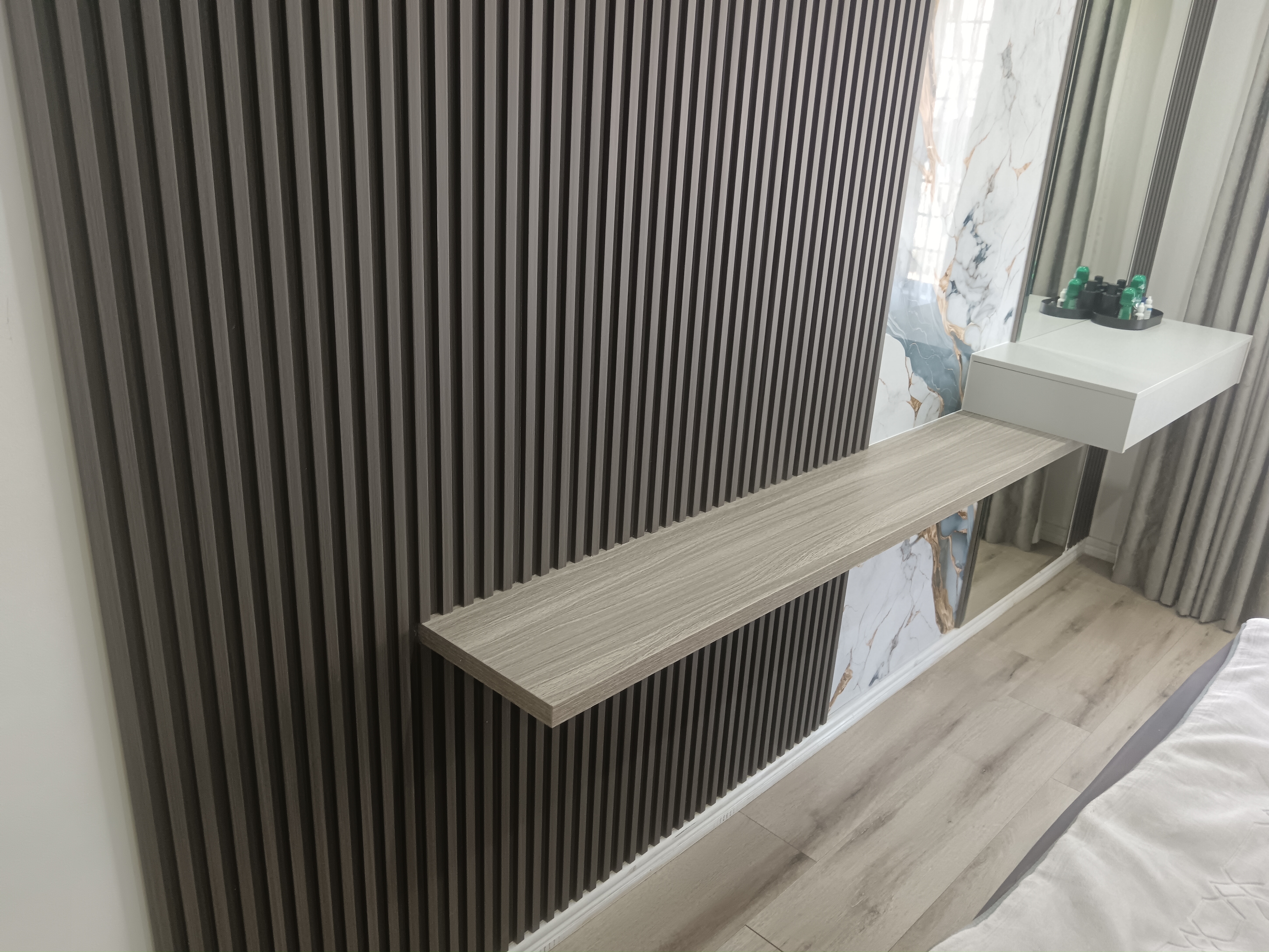 Brown timber slat detail on Musgrave bedroom feature wall