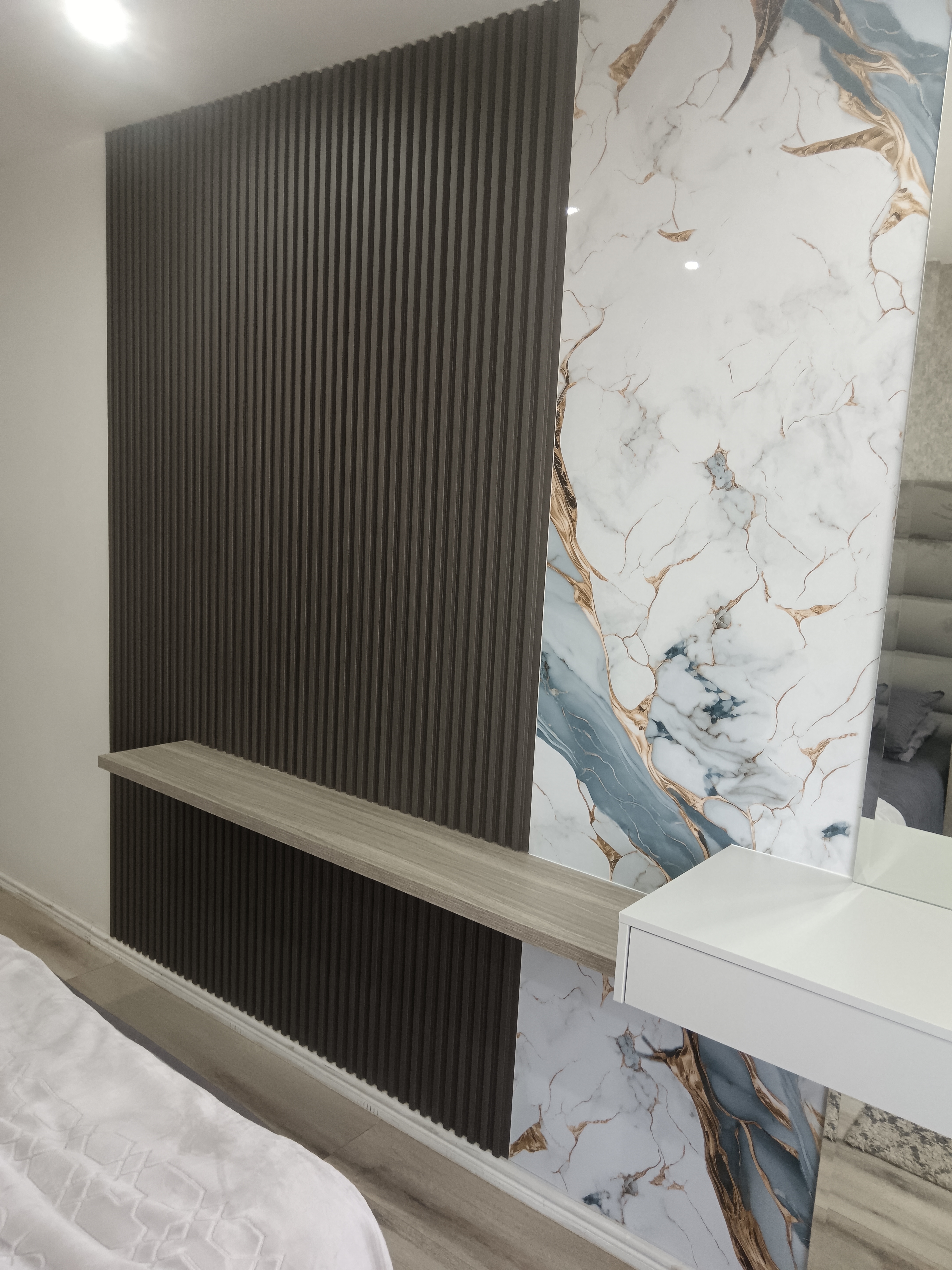 Blue-veined plastic marble sheeting on Musgrave feature wall
