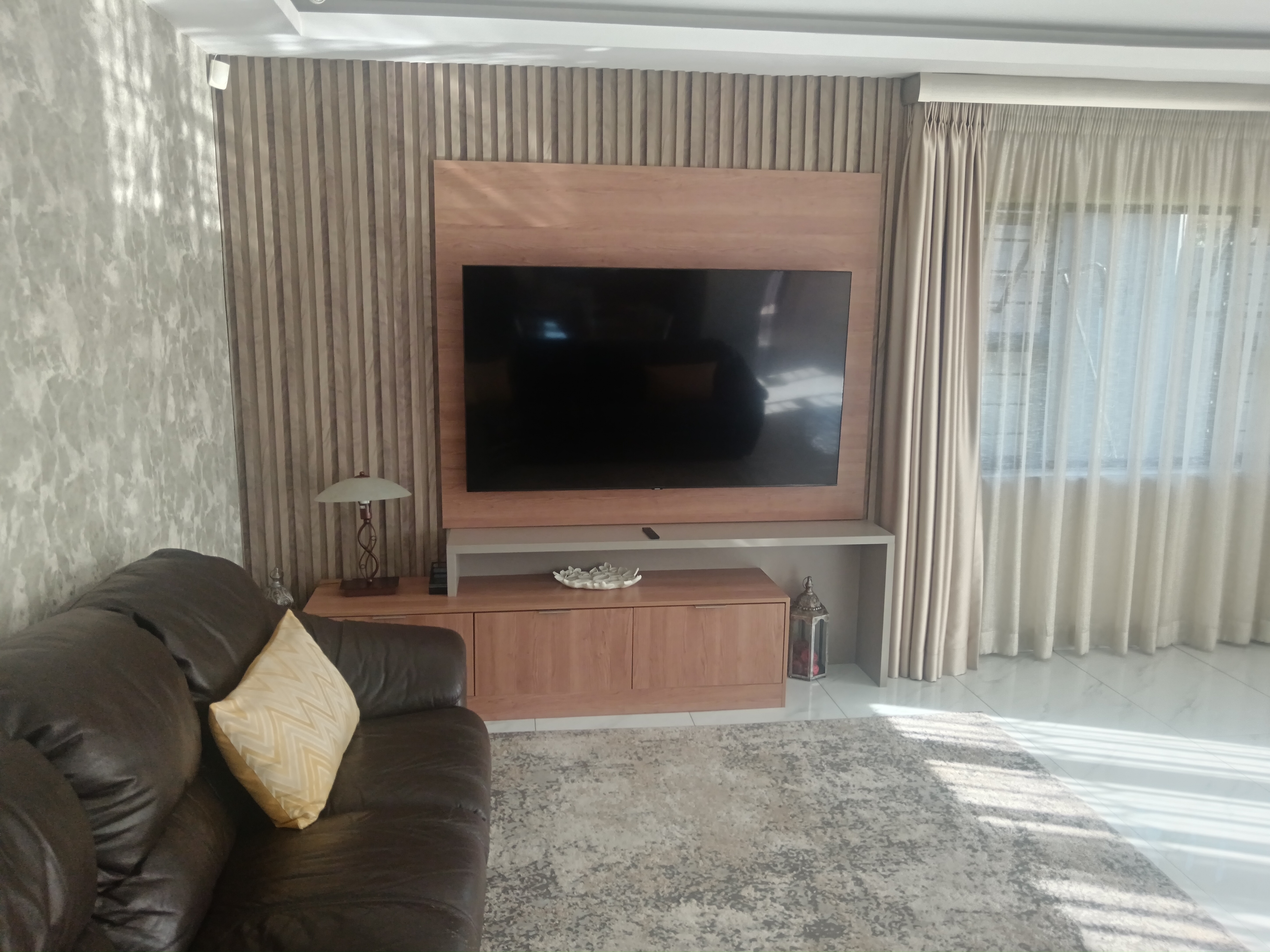 Custom TV Unit in Morningside - Wall-mounted entertainment center with storage