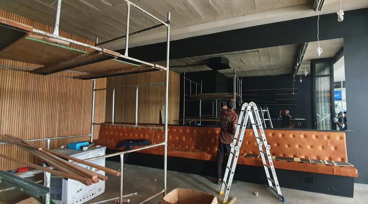 Modern restaurant interior fit-out with custom bar — Ballito KZN by El-Shaddai Interiors